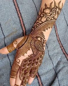 2. Peacock full hand bridal Mehndi design